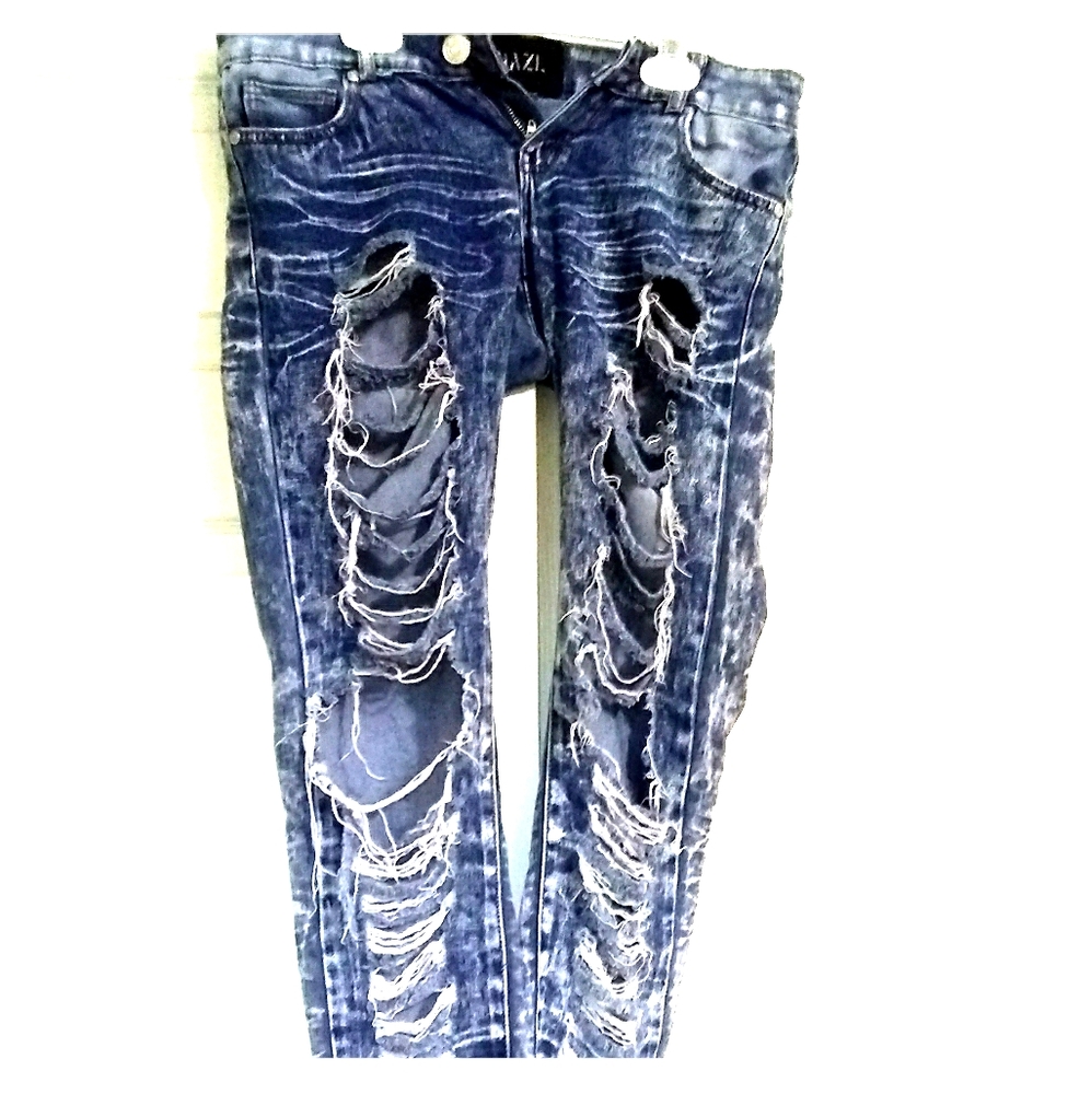Very distressed blue jeans